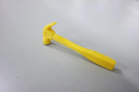 Selective focused, closeup view of toy hammer made from plastic Foto stock
