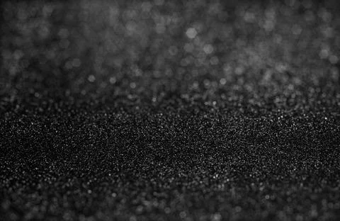 Selective focused at textured of black glitter background Foto stock
