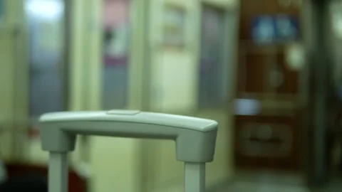 Selective focusing to a man hand while grab and hold the luggage and walk a.. Stock Footage 248197533