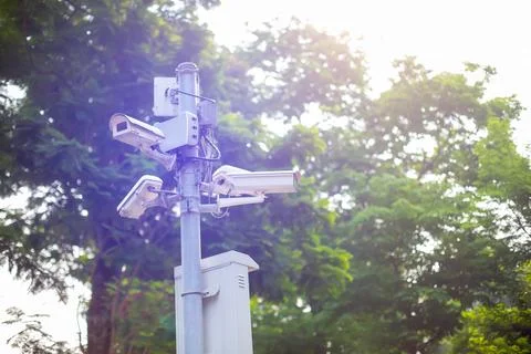 Selective focust to CCTV Camera and WIFI Device on metal pole with blurry t.. Stock Photos