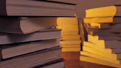Selective lighting Books on the table 스톡 동영상 72382233
