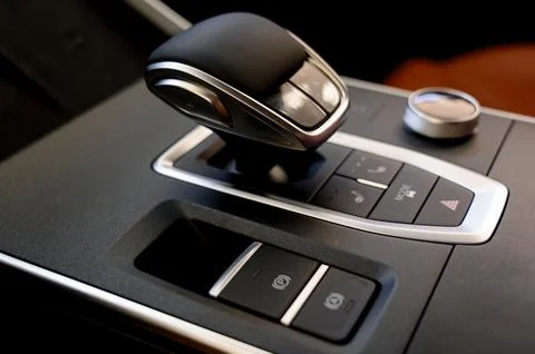 Selector automatic transmission with leather in the interior of a modern car. Stock Photos