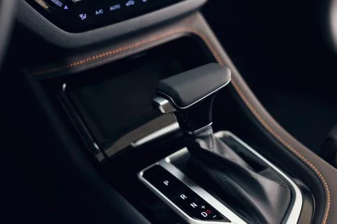 Selector automatic transmission with perforated leather in the interior of a  Stock Photos