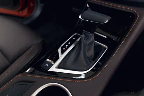 Selector automatic transmission with perforated leather in the interior of a  Stock Photos