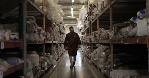 Selects the desired roll of fabric for quality control Stock Footage 107912967