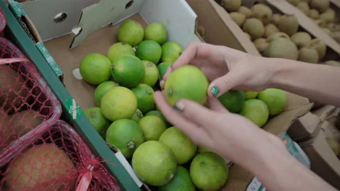 Selects the limes on the market Stock Footage 95401922