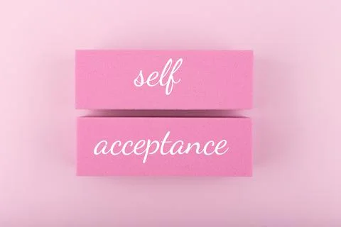 Self acceptance minimal creative concept in pink colors against pink background. Stock Photos