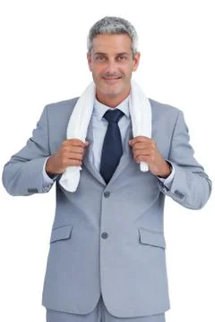 Self assured businessman with white towel on shoulders Stock Photos