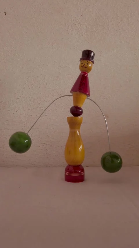 Self balancing Toy made of soft wood by Channapatna in Mysore, India. Stock Footage 290839060