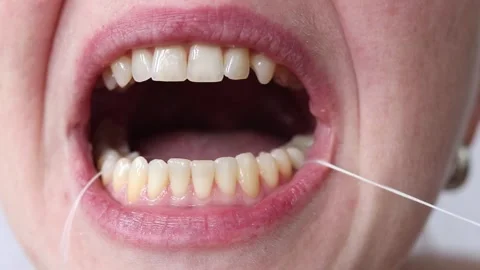 Self-care, brushing teeth with floss Stock Footage 346244476
