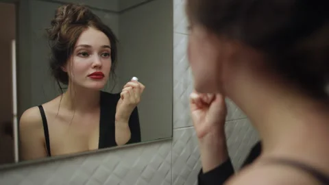 Self Care Ritual Applying Your Favorite Lipstick in the Mirror with Confidence a Stock Footage 314905736