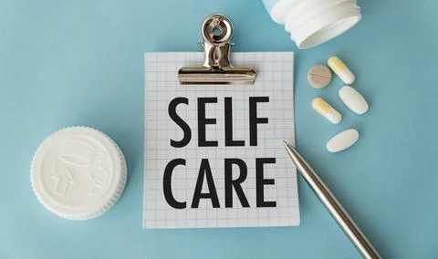 Self Care text written on a notepad . The concept of coronavirus. Stock Photos