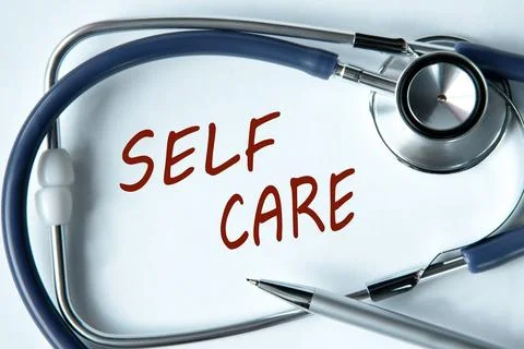 SELF CARE - words on white background with pen and stethoscope Stock Photos