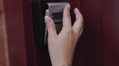 Self check in keybox for rent apartment or home. House sefety concept.	 Video stock 300761623
