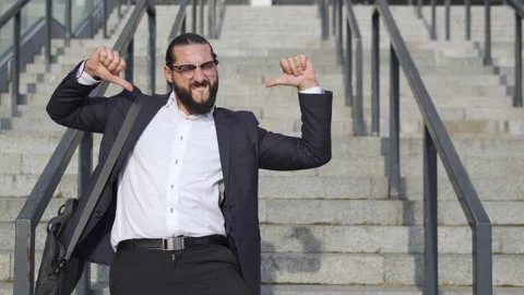 Self confident bearded man dancing on staircase, celebrate victory, real estate Stock Footage 163347274