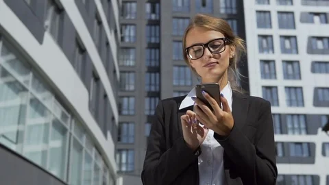 Self-confident Businesswoman Texting on Phone Stock Footage
