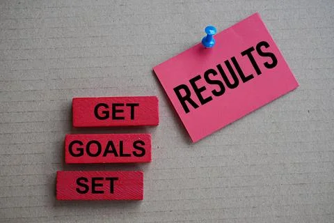 Self development concept. Words set goals get results wooden blocks and stickers 写真素材