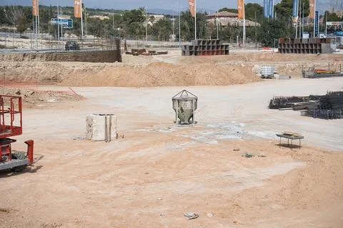 Self-discharge hopper for crane in a construction of an urbanization. Stock Photos