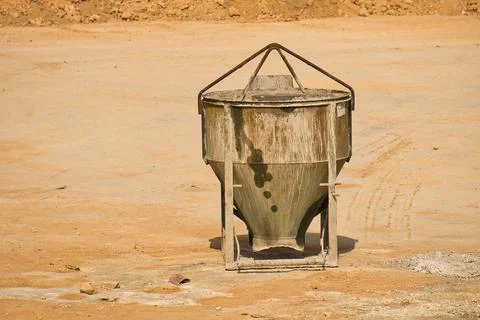 Self-discharge hopper for crane in a construction of an urbanization Stock Photos