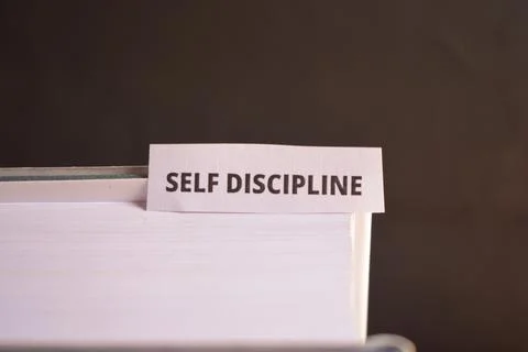 Self Discipline Bookmark Inserted in Book Representing Personal Growth and .. Stock Photos