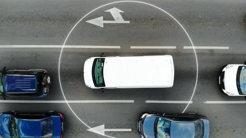 Self Driving Autopilot smart car driving on road in the city. Aerial top view on Stock Footage