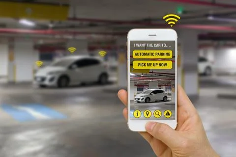 Self-Driving Car Controlled with App on Smartphone to Park in Parking Lot C.. Stock Photos