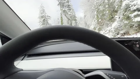 Self driving car operating on an open winter road Stock Footage 225679980