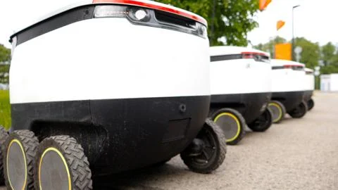 Self Driving Delivery Robots Preparing For Urban Last Mile Logistics Stock Photos