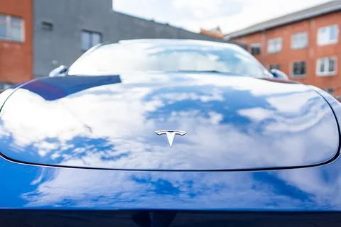 Self driving Tesla Model Y Exterior. Blue metallic, black titanium rims Stock Photos