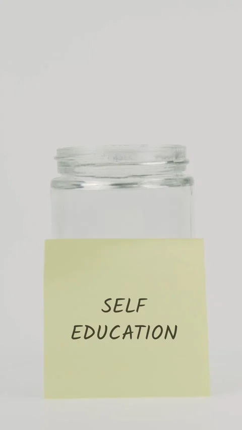 Self education text or word on yellow sticky note attached to glass jar Stock Footage 311785306