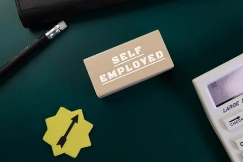 Self employed concept with tools for freelancers on desk Stock Photos