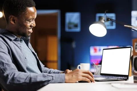 Self employed individual glances at empty layout on laptop Stock Photos