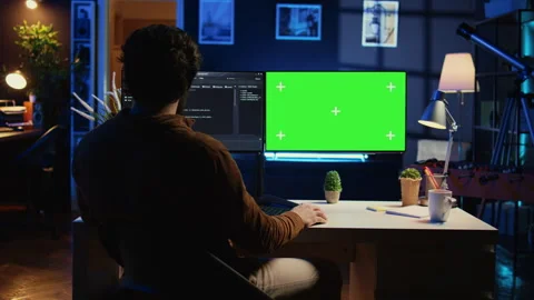 Self employed man doing IT support job, coding on green screen PC Stock Footage 265342685
