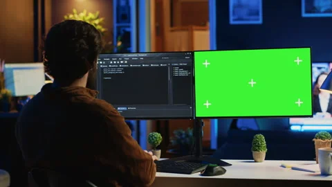 Self employed man doing IT support job, coding on green screen PC Stock Footage 265511118