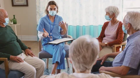 Self help therapy group meeting in nursing home during covid Stock Footage 150827294