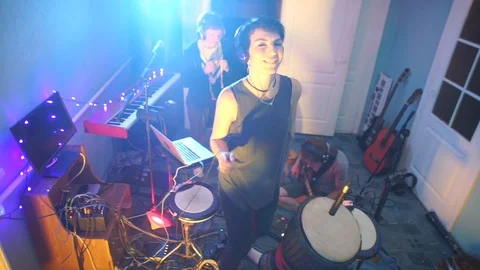 Self-isolation at home COVID-19. Music teacher dancing among musicians rehearsal Stock Footage 115064951