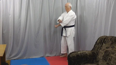 In self-isolation, a man trains a kick Stock Footage 129790059