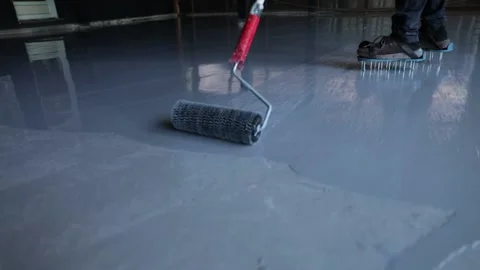 Self-leveling resin epoxy. Leveling with a mixture of epoxy floors Stock Footage 150875068