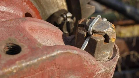 A self-locking nut securely fastens a car spare part, close-up Stock Photos