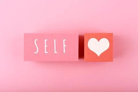 Self love minimal creative concept in pink colors against pink background with Stock Photos