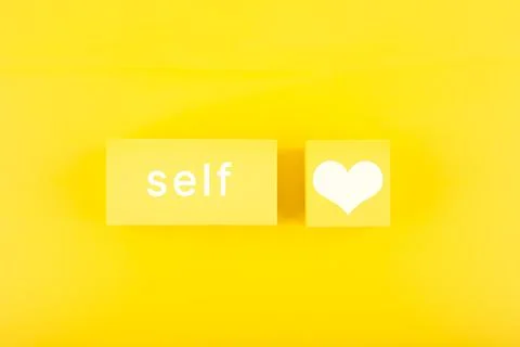 Self love minimal creative concept with yellow geometric figures with text on Stock Photos
