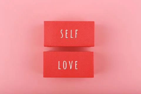 Self love minimal creative concept in pink colors against pink background.Mental Stock Photos