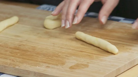 Self made Baking: Couple Rolling Dough for self made Cookies On A Wooden Board 動画素材 118602909