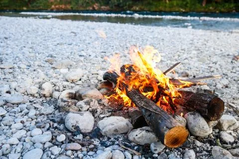 Self-made campfire by the mountain river Stock Photos
