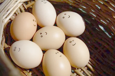 Self Made Hand Drawn - Group of emotional eggs. They are in a basket . Stock Photos