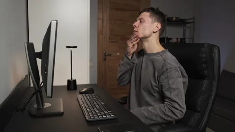 Self massage man massaging face neck happy working at computer authentic home Stock-Footage 316053837