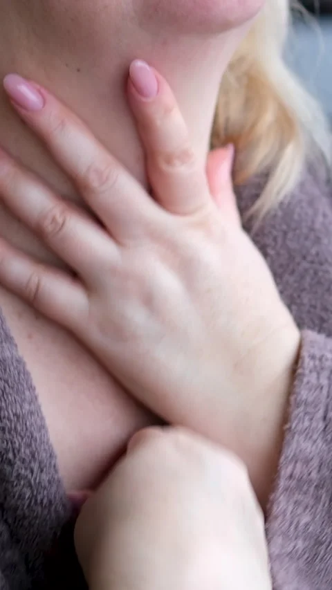 Self-massage of neck Middle-aged woman applying cream to her neck in a spa-like Stock Footage 302178822