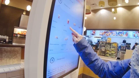 Self-Ordering Meal Using McDonald's Touchscreen Kiosk Stock Footage 101406910