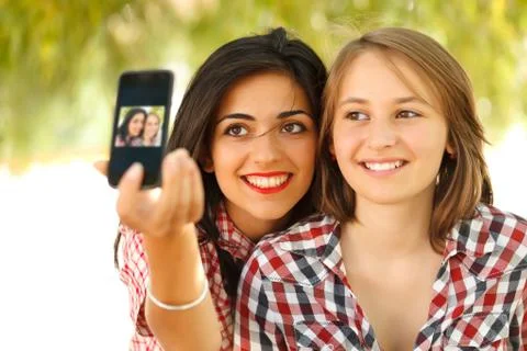 Self portrait with smartphone Stock Photos