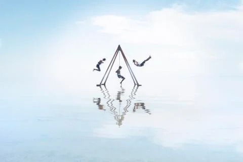 Self Portrait on Swing Set in Reflection on Salton Sea Californi Stock Photos